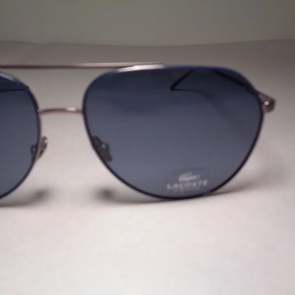 Lacoste l209s silver