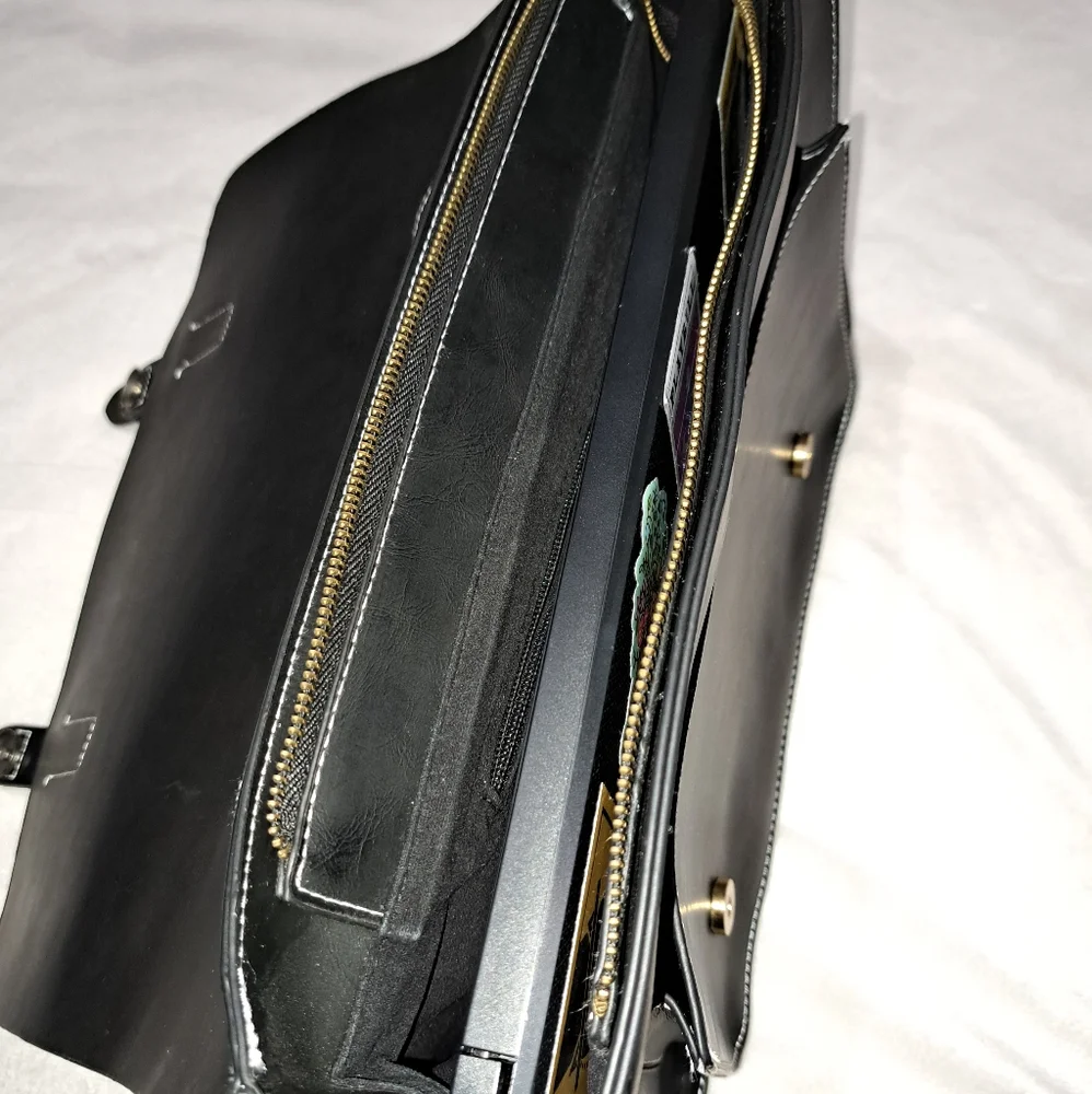 Leather like briefcase. Holds a 13 inch laptop.