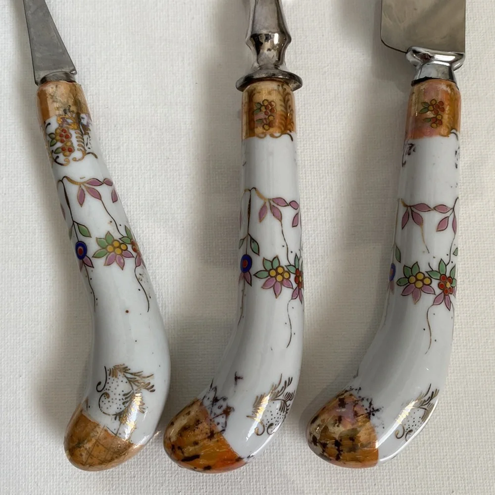 Lovely set of vintage serve ware with floral porcelain handles