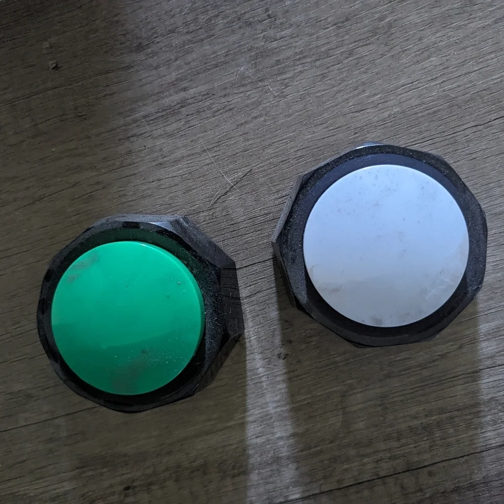 2 non used dog training buttons.