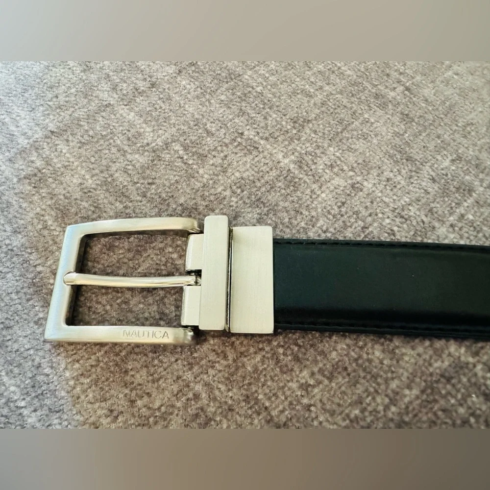 A set of two boys belts: Dockers (size 22-24) and Nautica (size 28).