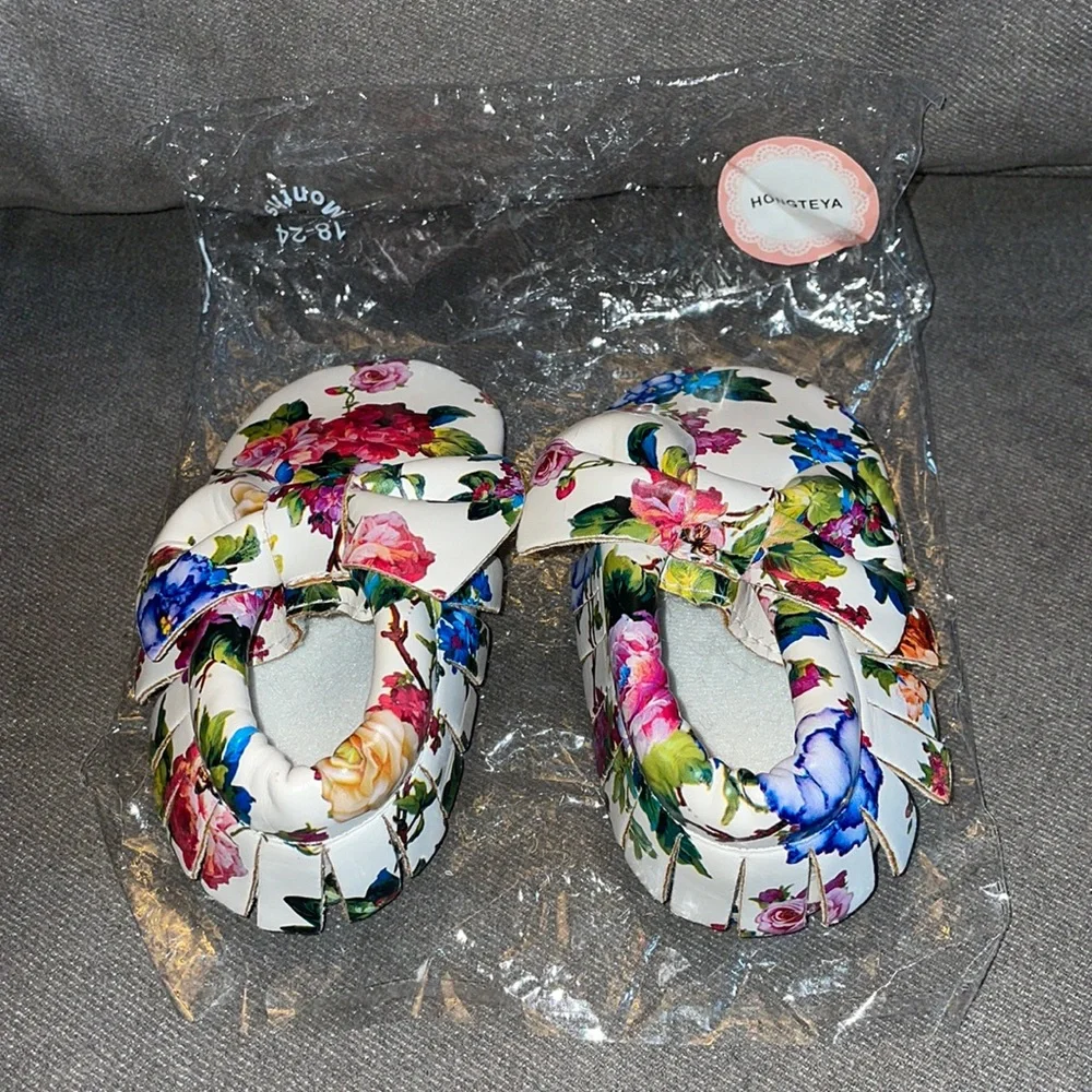 NWT.  Girls floral leather moccasins.  18-24 months.  Size 5