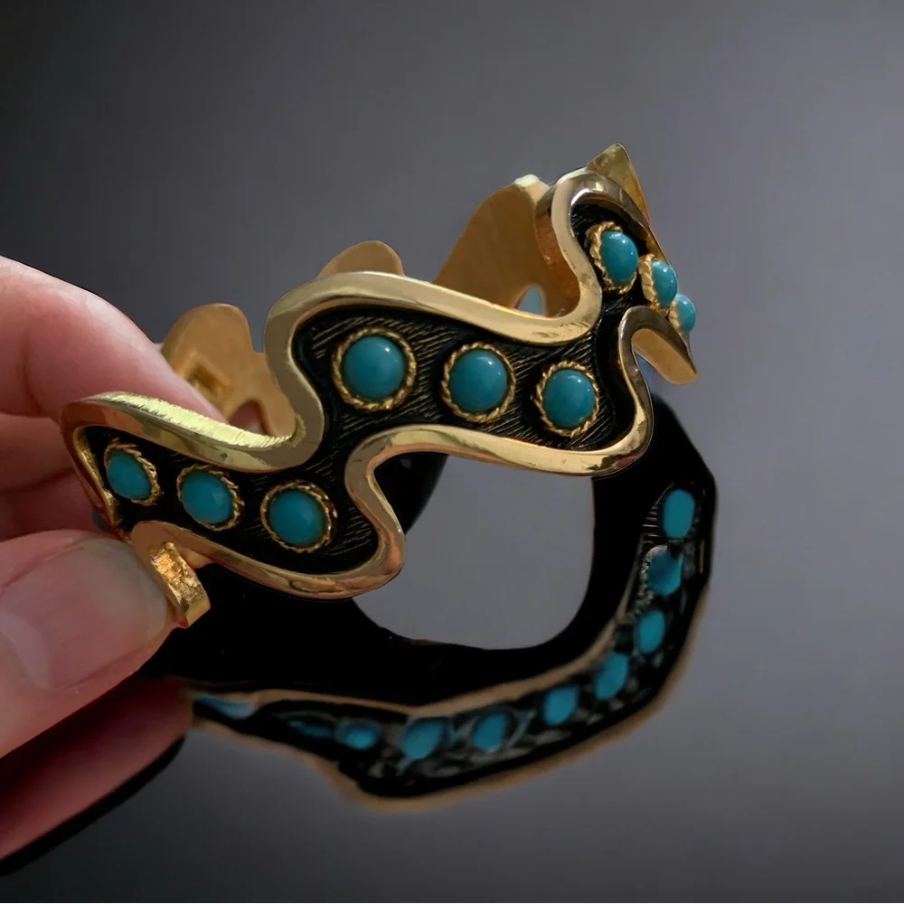 Striking vintage turquoise color black and gold cuff bracelet