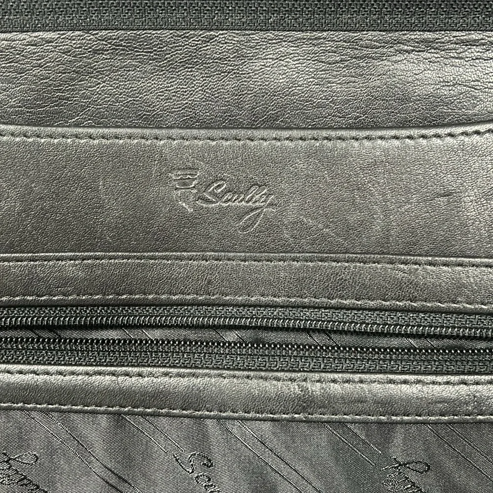 Scully stains outside briefcase