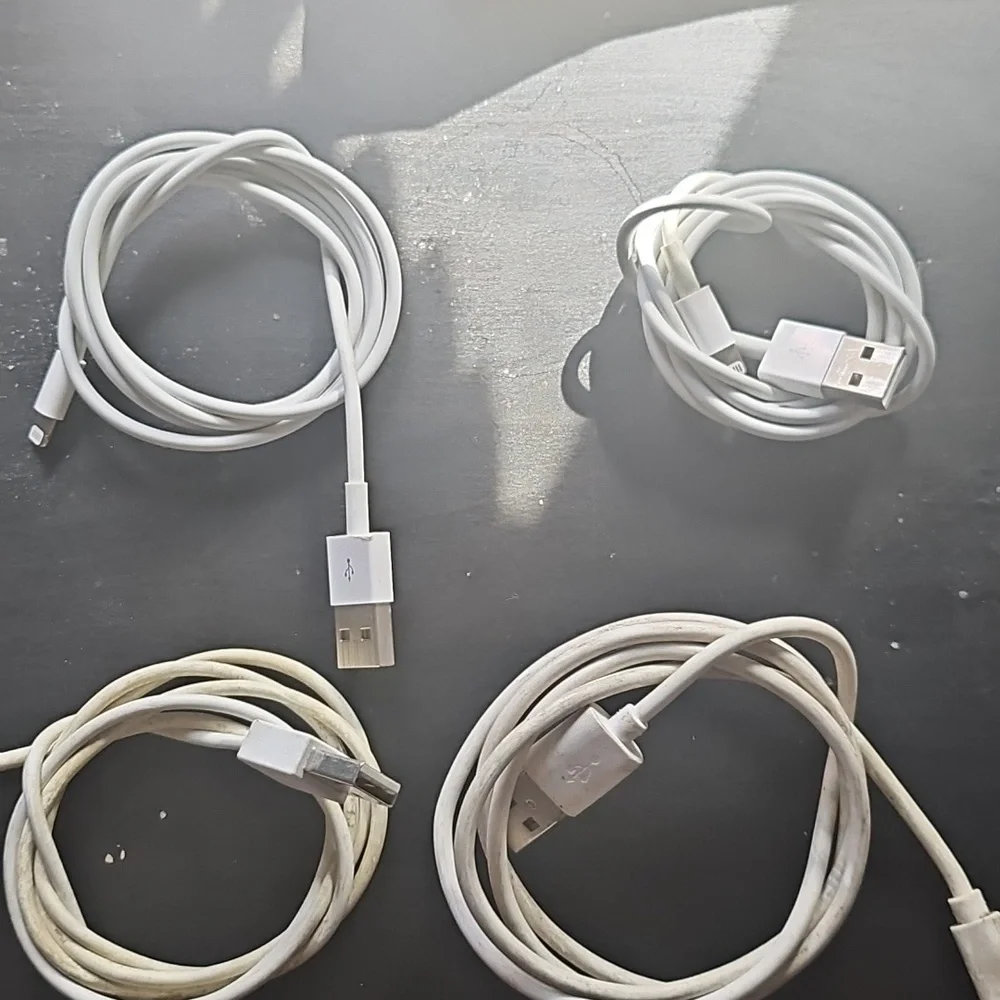 Bundle of white USB to Apple Lightning Charging Cables