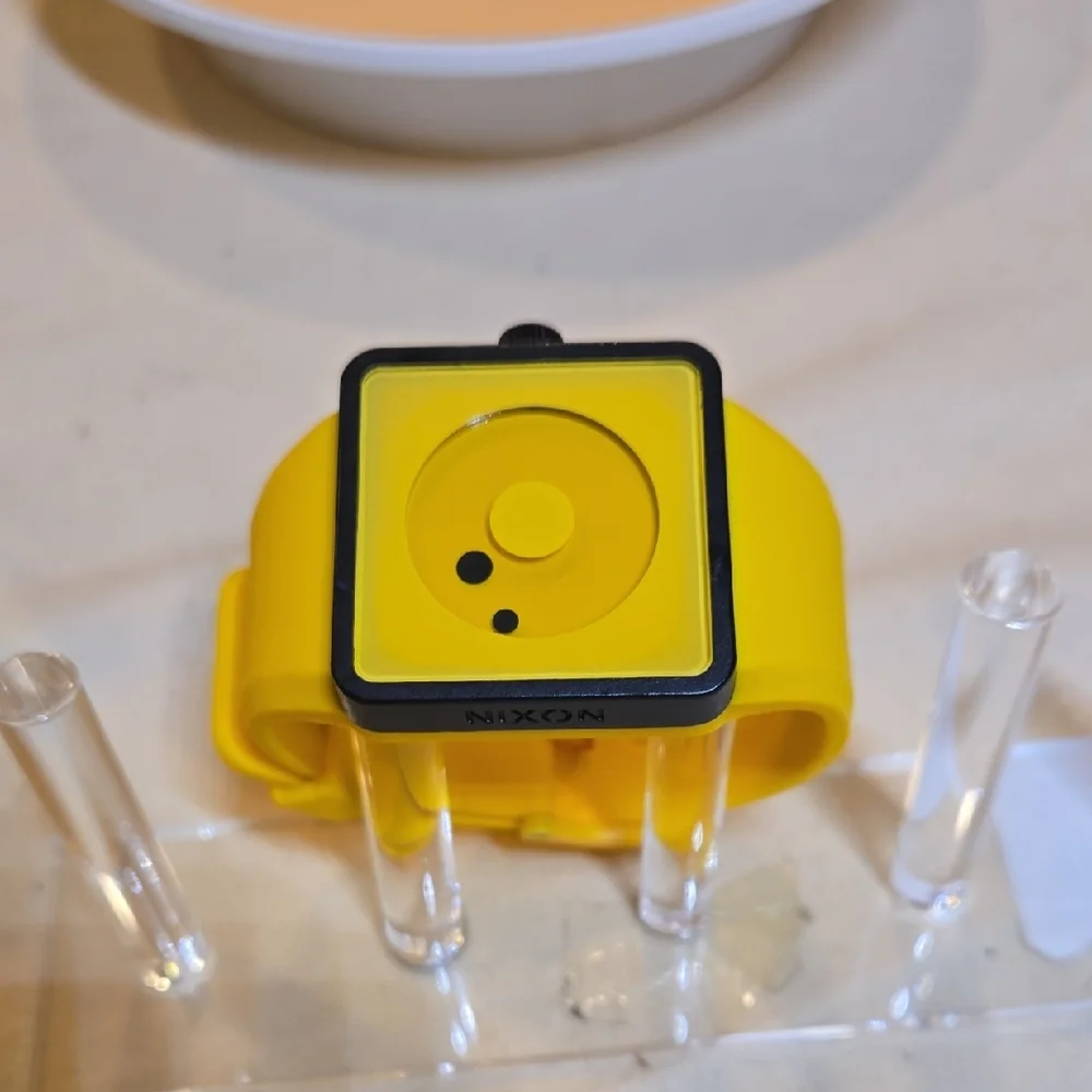 Nixon Yellow Smartwatch with Minimalist Design