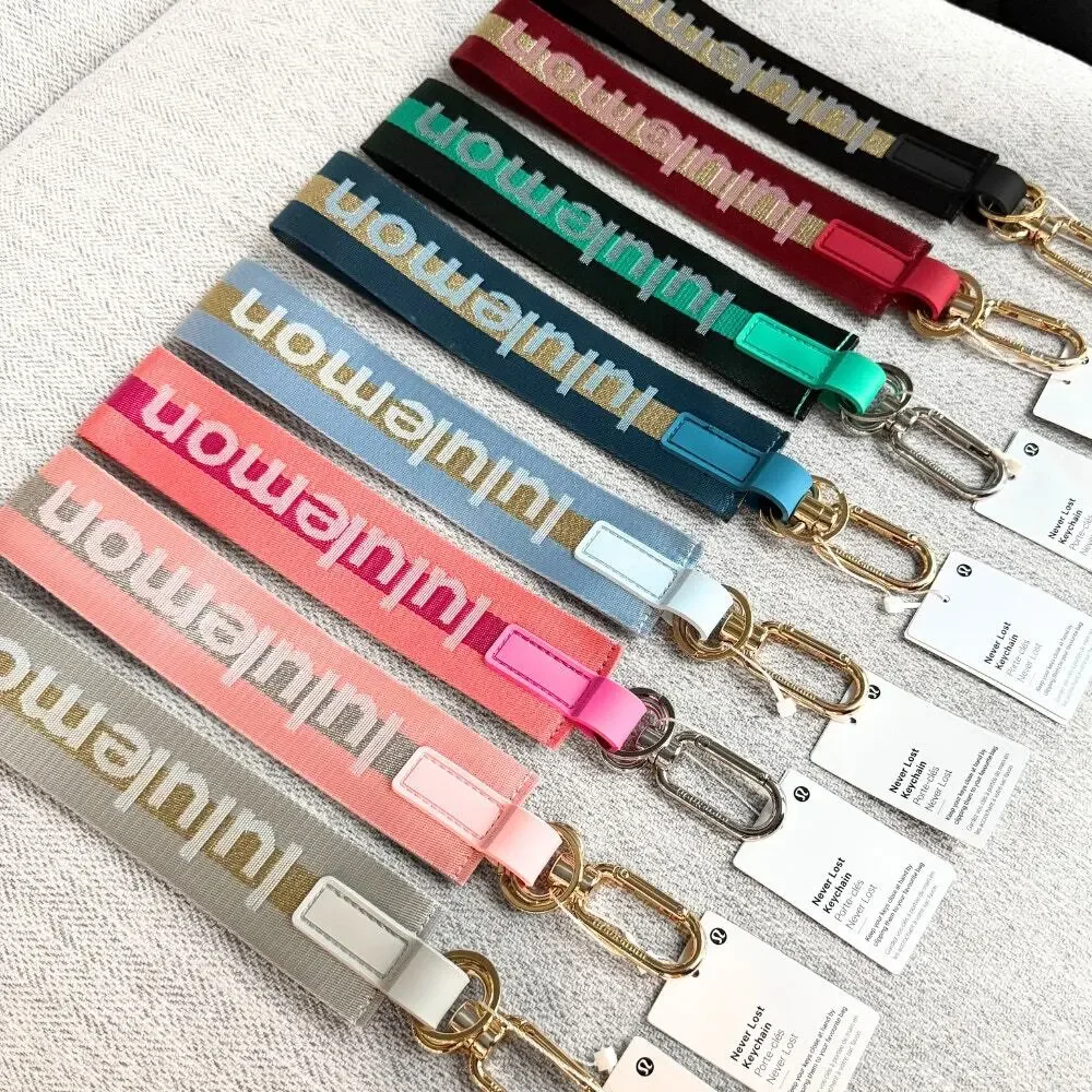 NEW Lululemon Never lost Keychain Wordmark Baby Blue Gold
