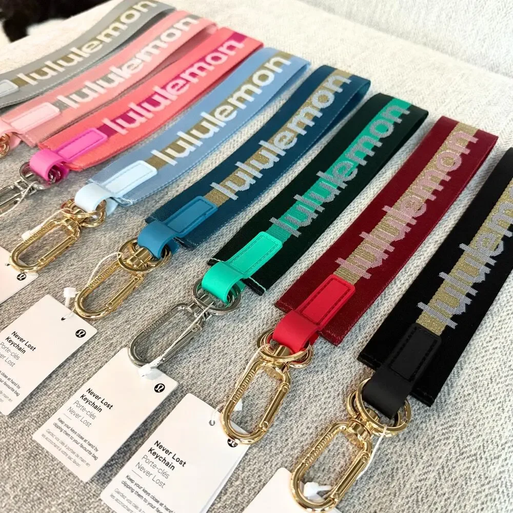 NEW Lululemon Never lost Keychain Wordmark Baby Blue Gold