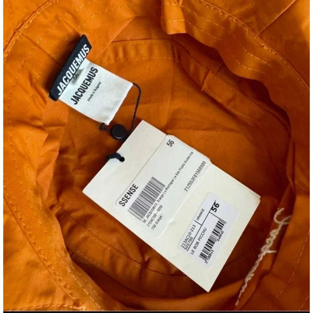Jacquemus orange logo bucket hat seen on Hailey size56