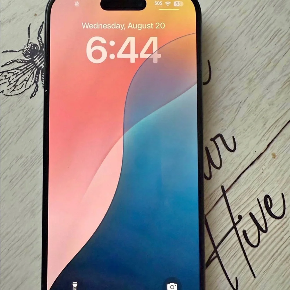 Apple Smartphone with Black Frame and Colorful Display +airpods generation 4 Pro