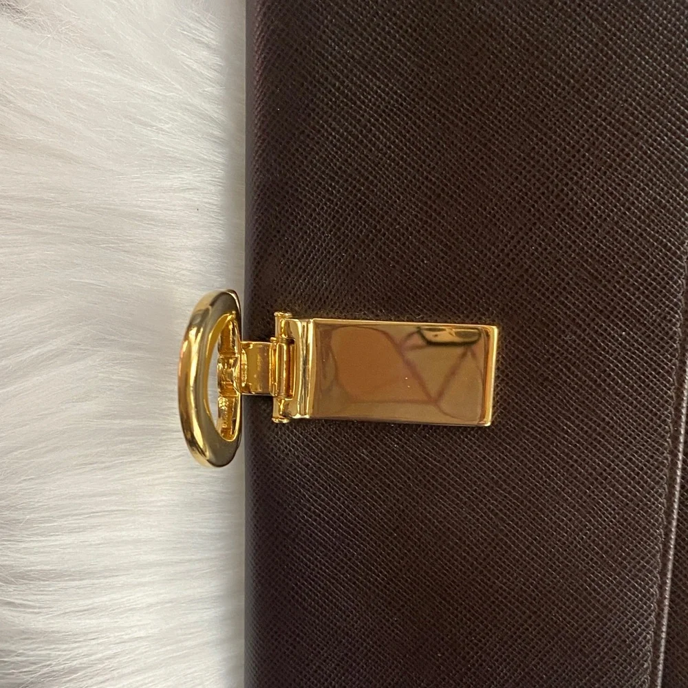 Salvatore Ferragamo Deep brown leather wallet with gold accent