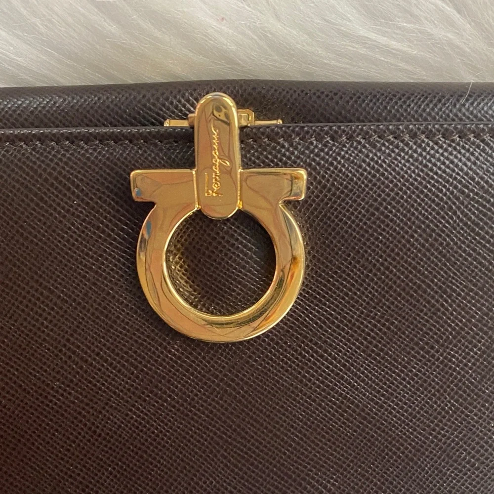 Salvatore Ferragamo Deep brown leather wallet with gold accent