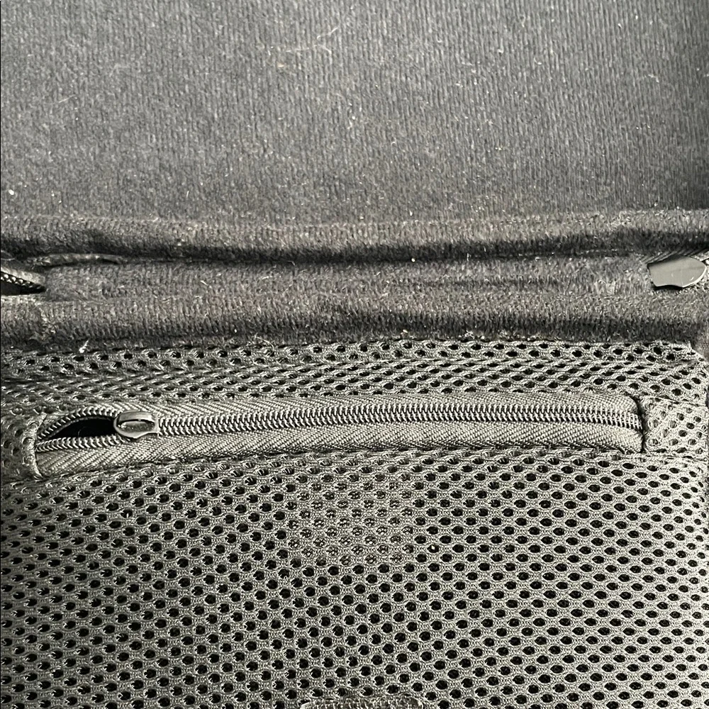 Nintendo Switch Black case with red and light grey accent stitching.