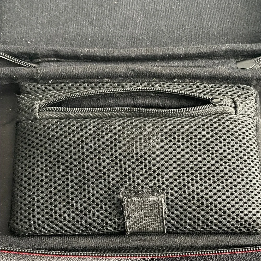 Nintendo Switch Black case with red and light grey accent stitching.