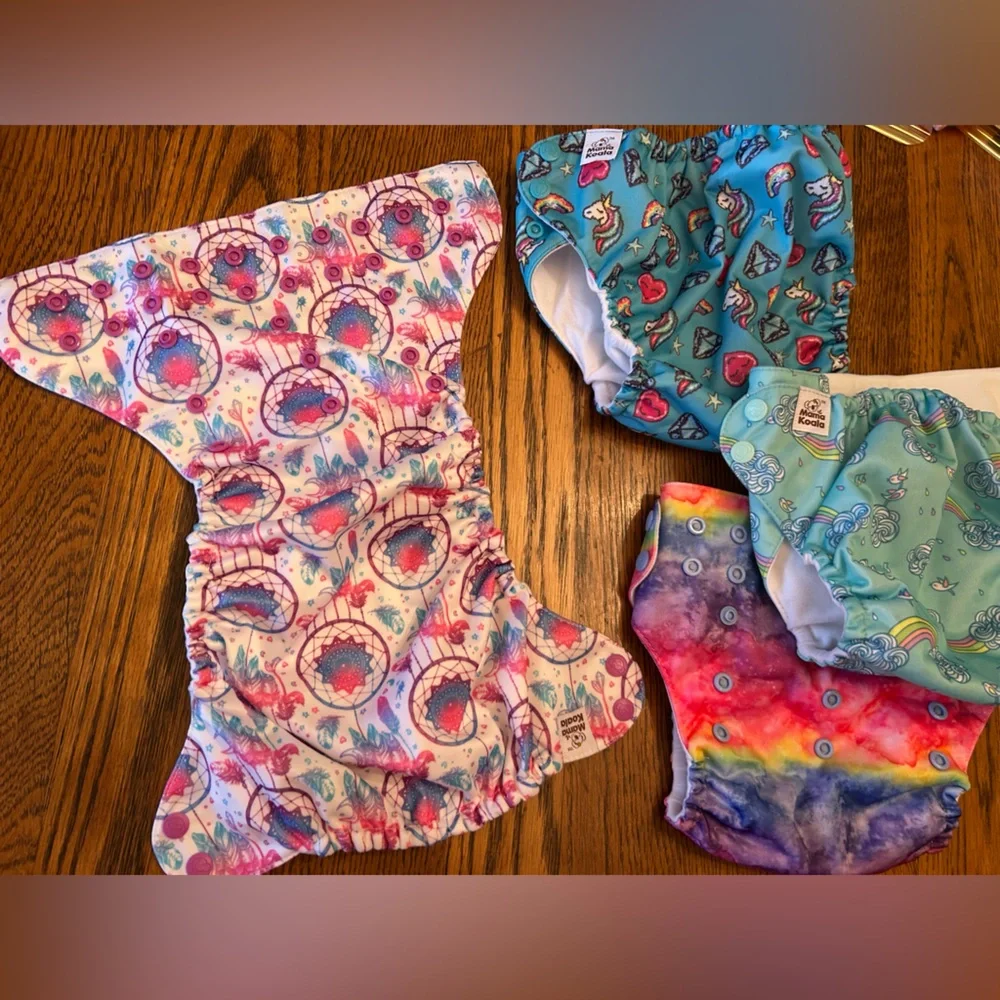 Colorful Kids Cloth Diaper Cover Set/4. (Value of 31 on website)Like new. Easy !