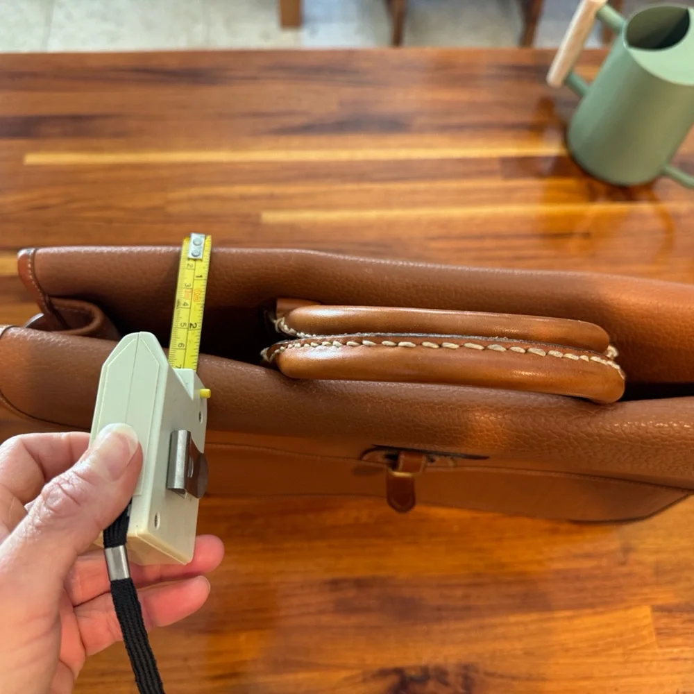 Vintage camel colored Dooney and Bourke all weather leather briefcase/laptop bag