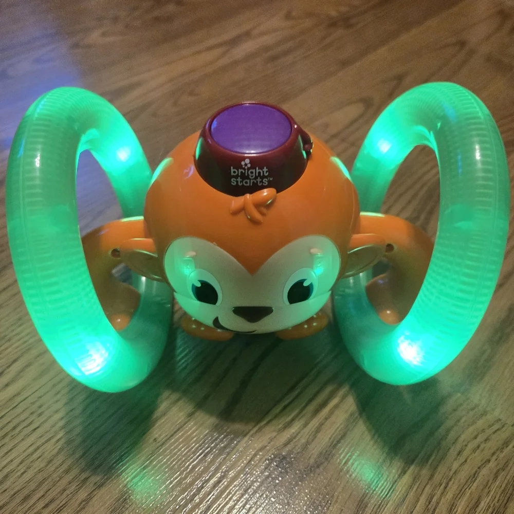 Bright Starts Roll & Glow Monkey  Colorful Rolls Sings Baby Infant Crawling Toy
