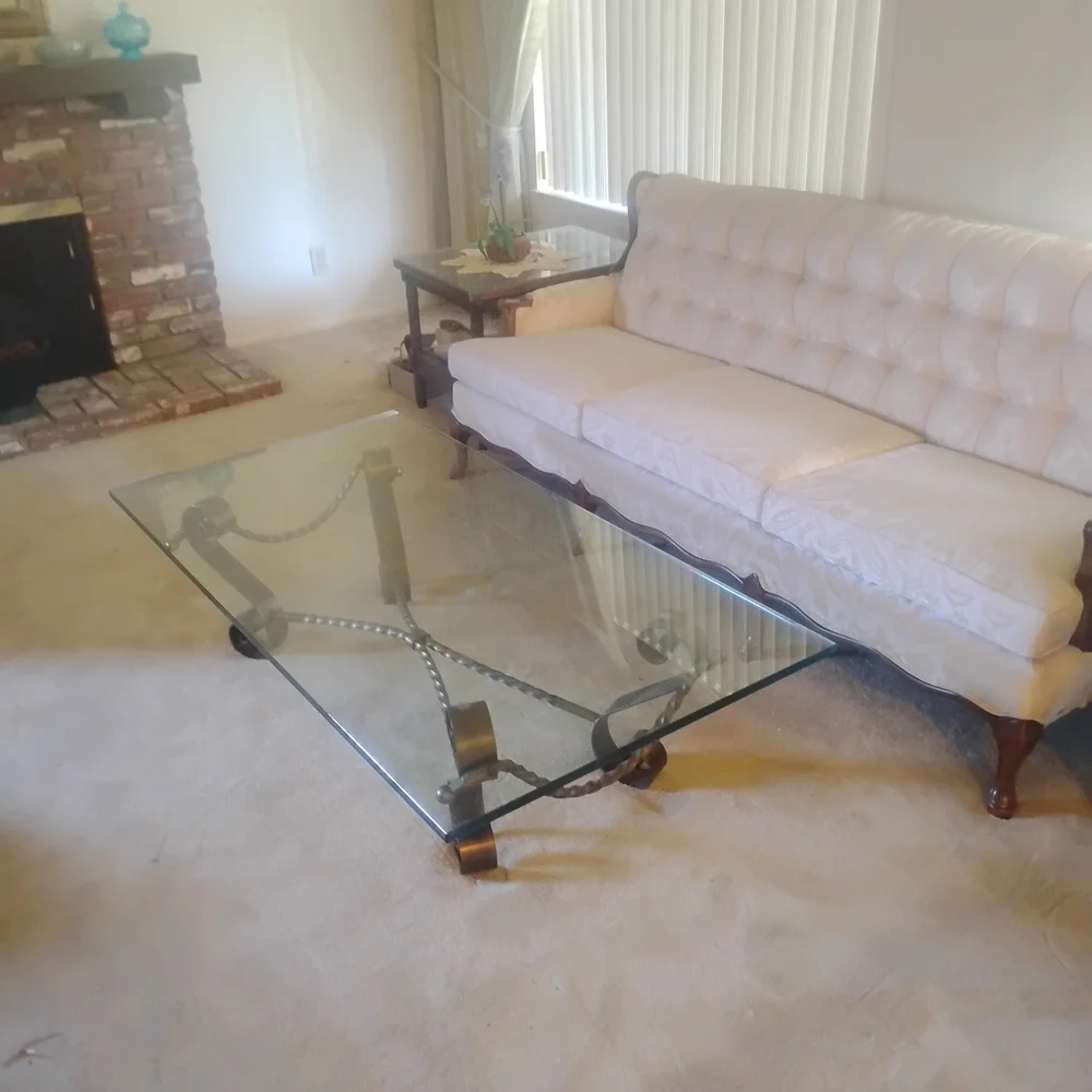 Elegant Glass Coffee Table with Black Metal Accents