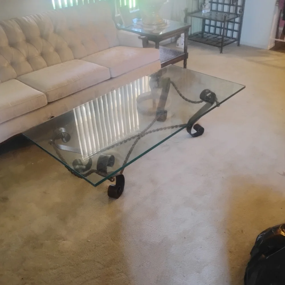 Elegant Glass Coffee Table with Black Metal Accents