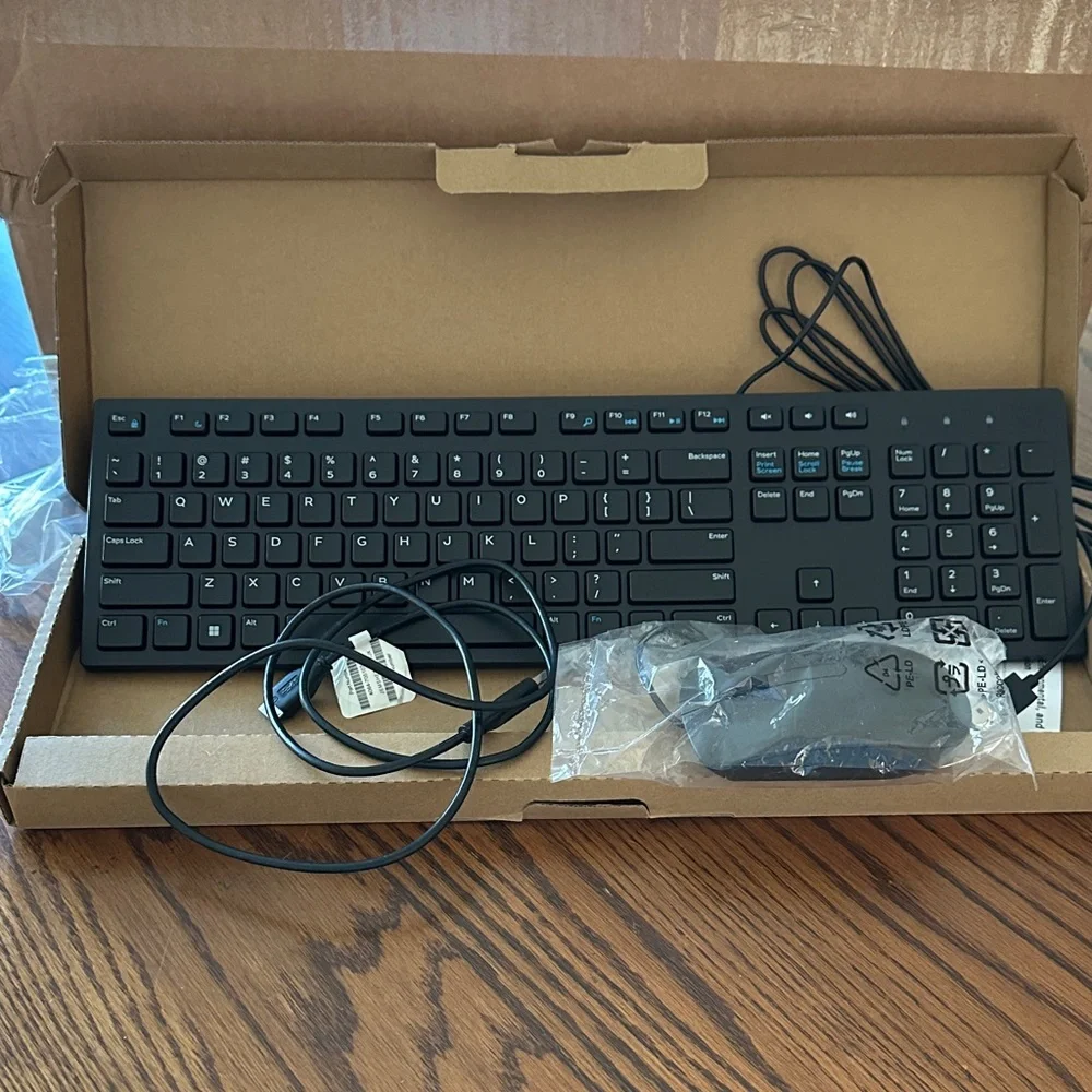 Dell Black Wired Keyboard with USB Connection and plugin mouse.