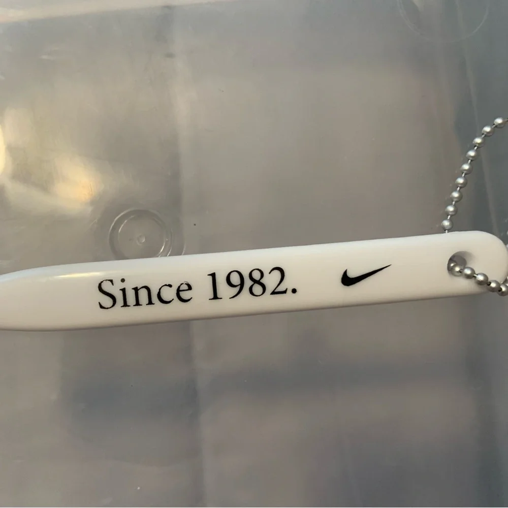 Nike White Keychain with Black Text TOOTHBRUSH