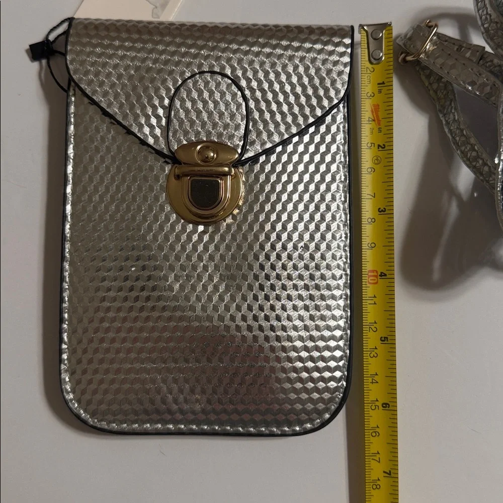 Cruise Club Metallic Silver Crossbody Pouch/Bag with Gold Lock. 2 Compartments