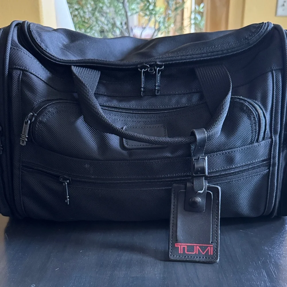 Tumi Black Men's Duffel with Red Logo Luggage Tag