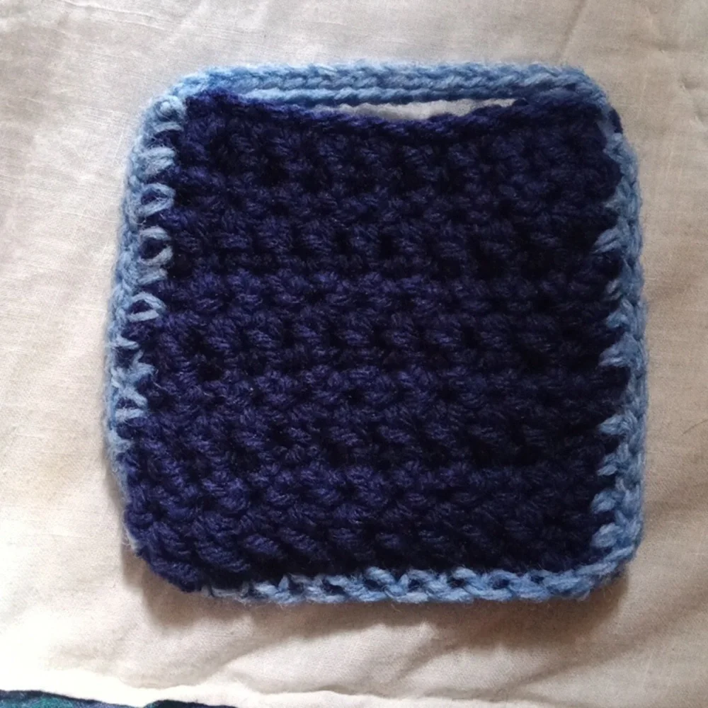 Hand Made Blue Crochet Soap Handbag with Floral Accent And Light Blue Edges