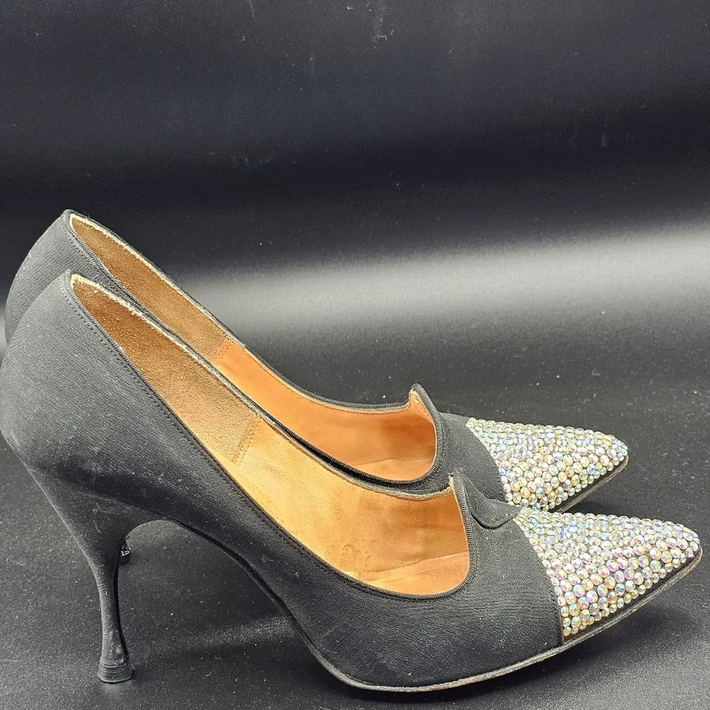 Jacques Heim pumps with a rhinestone-embellished toe.