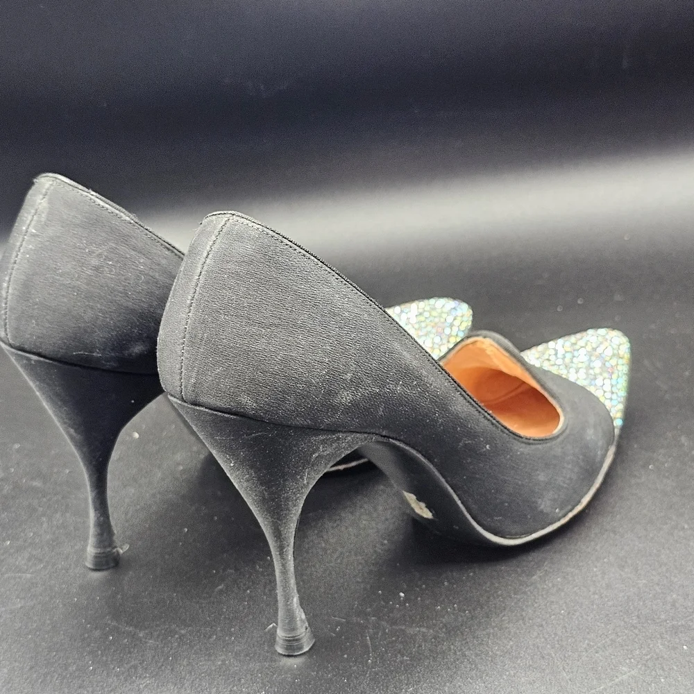 Jacques Heim pumps with a rhinestone-embellished toe.