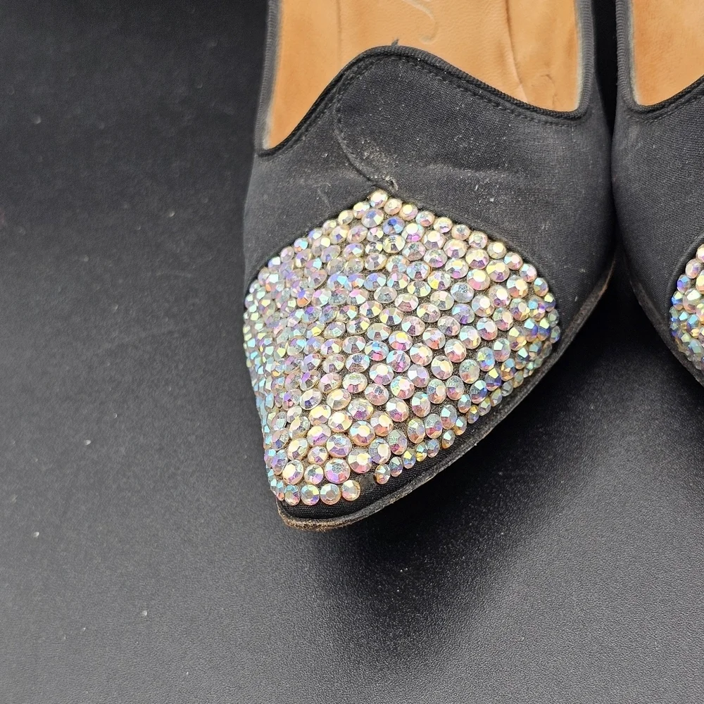 Jacques Heim pumps with a rhinestone-embellished toe.