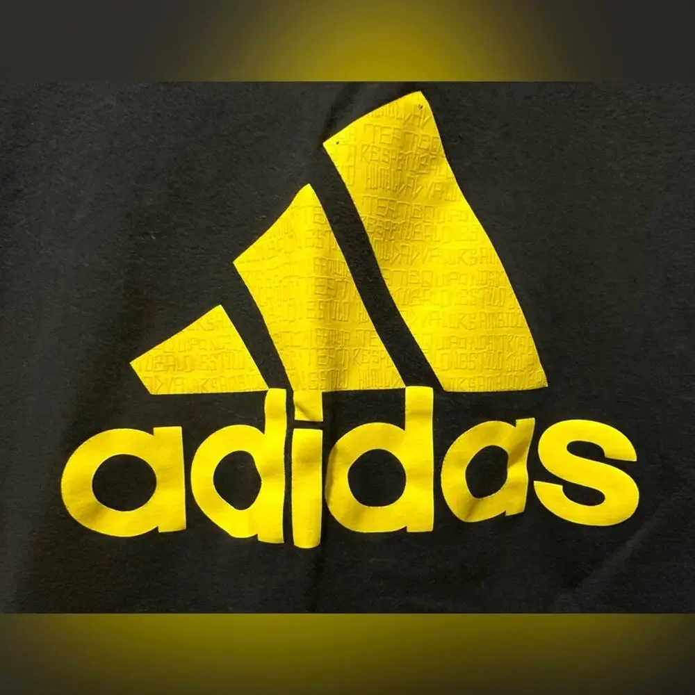 Black and yellow Adidas shirt‎