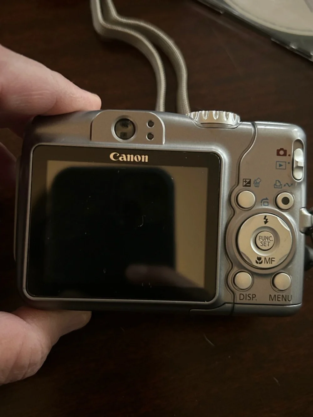 Canon Silver A710 Point-and-Shoot Digital Camera with Black Case and Cable