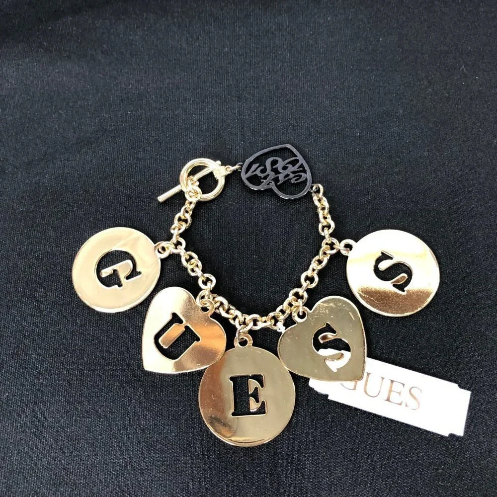 GUESS GOLD TONE LETTER CHARMS 7