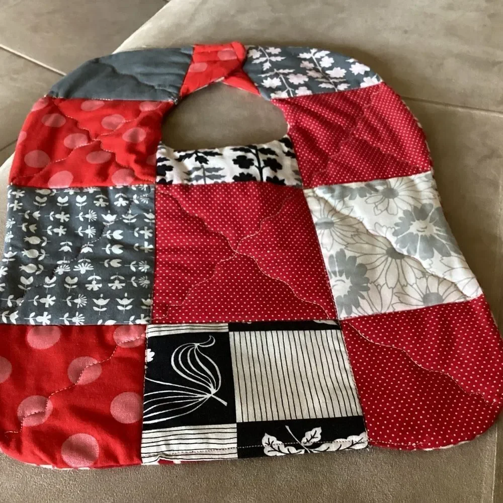 NWT , quilted reversible, handcrafted, baby bib reds