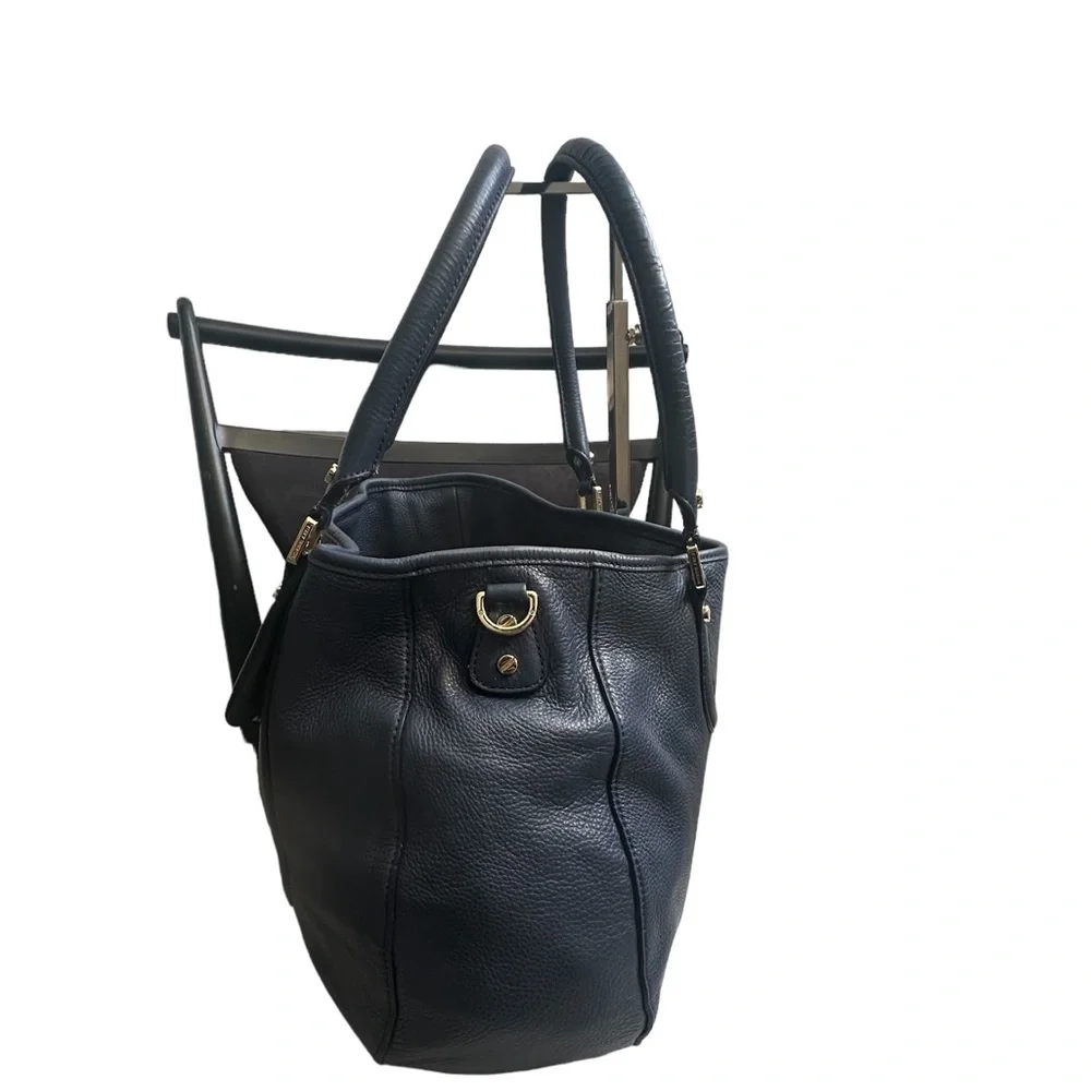 Tory Burch handles approximate