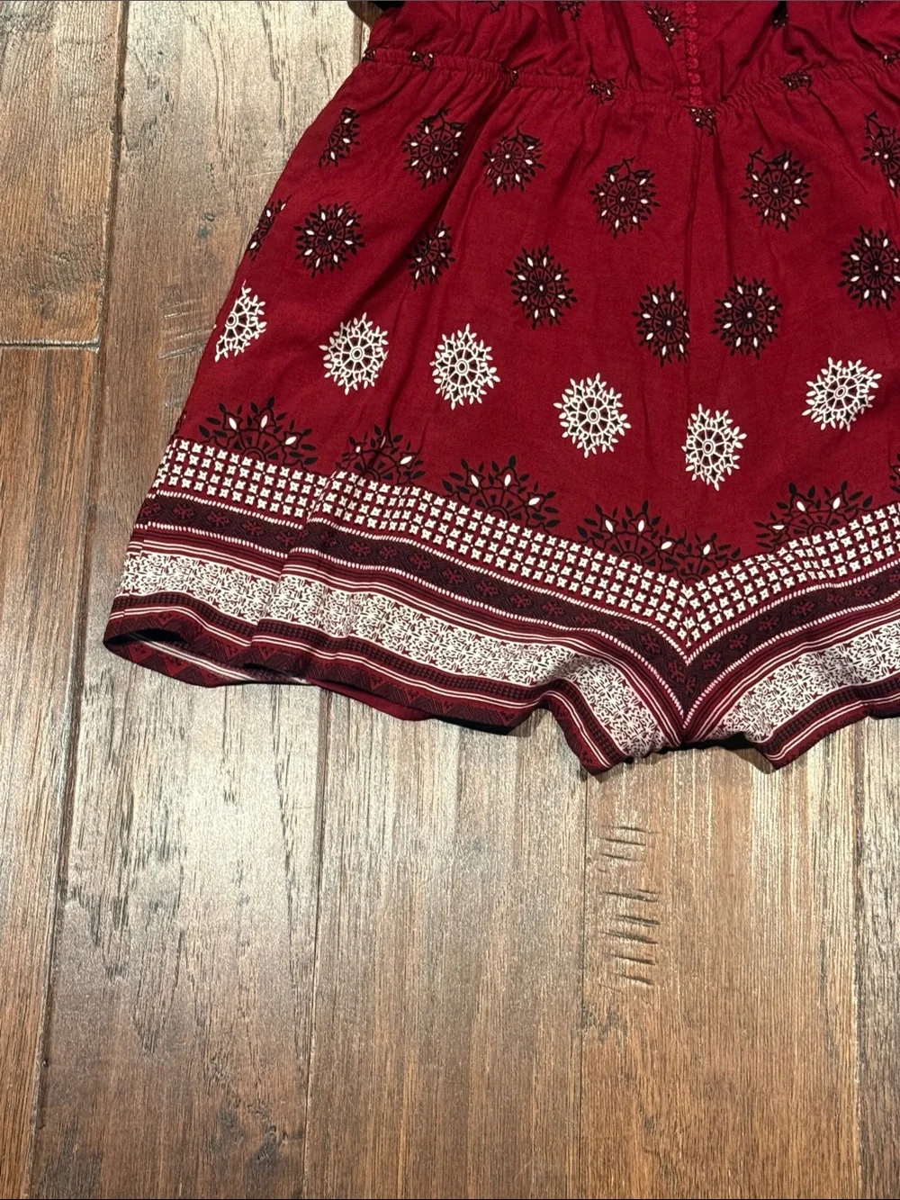 Size Medium Women’s Burgundy Printed Romper with V-Neck