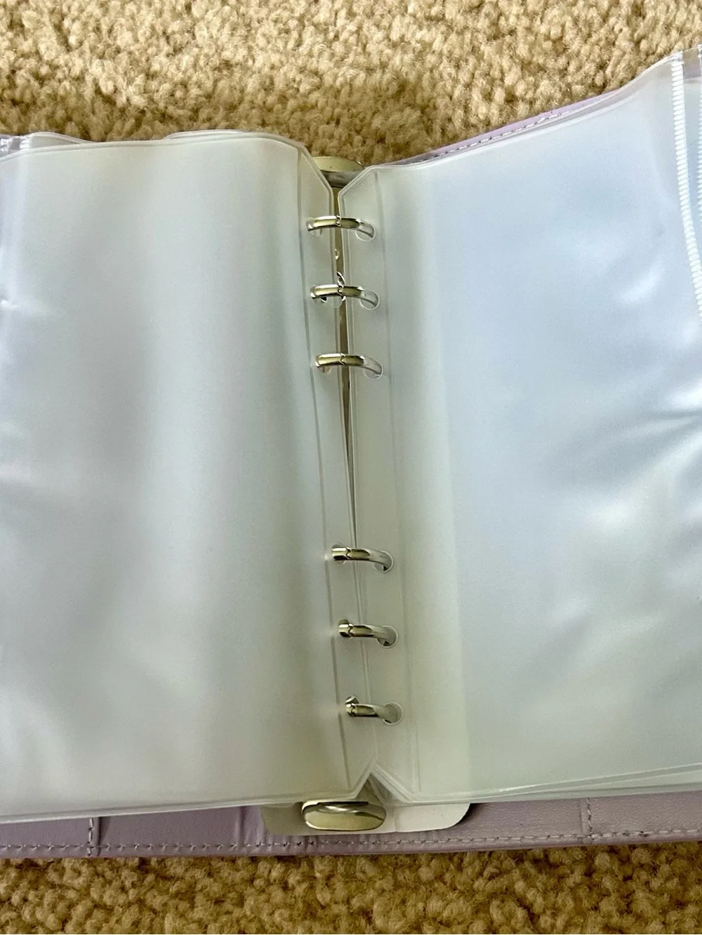 Lilac color budget binder with magnetic closure.