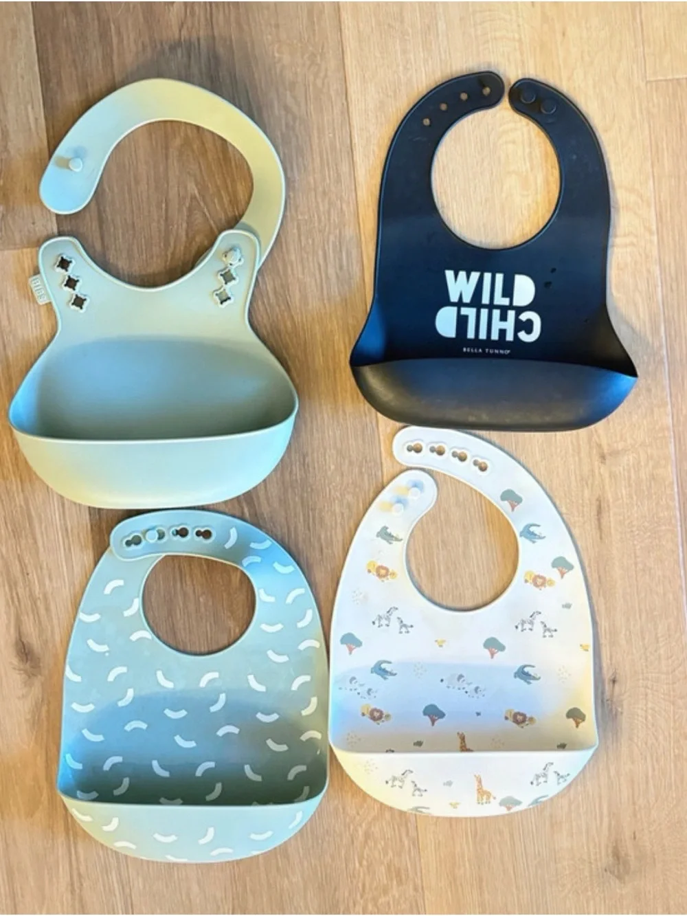 Set of 4 Silicone Baby Bibs including BIBS, Bella Tunno, and Austin Baby Co
