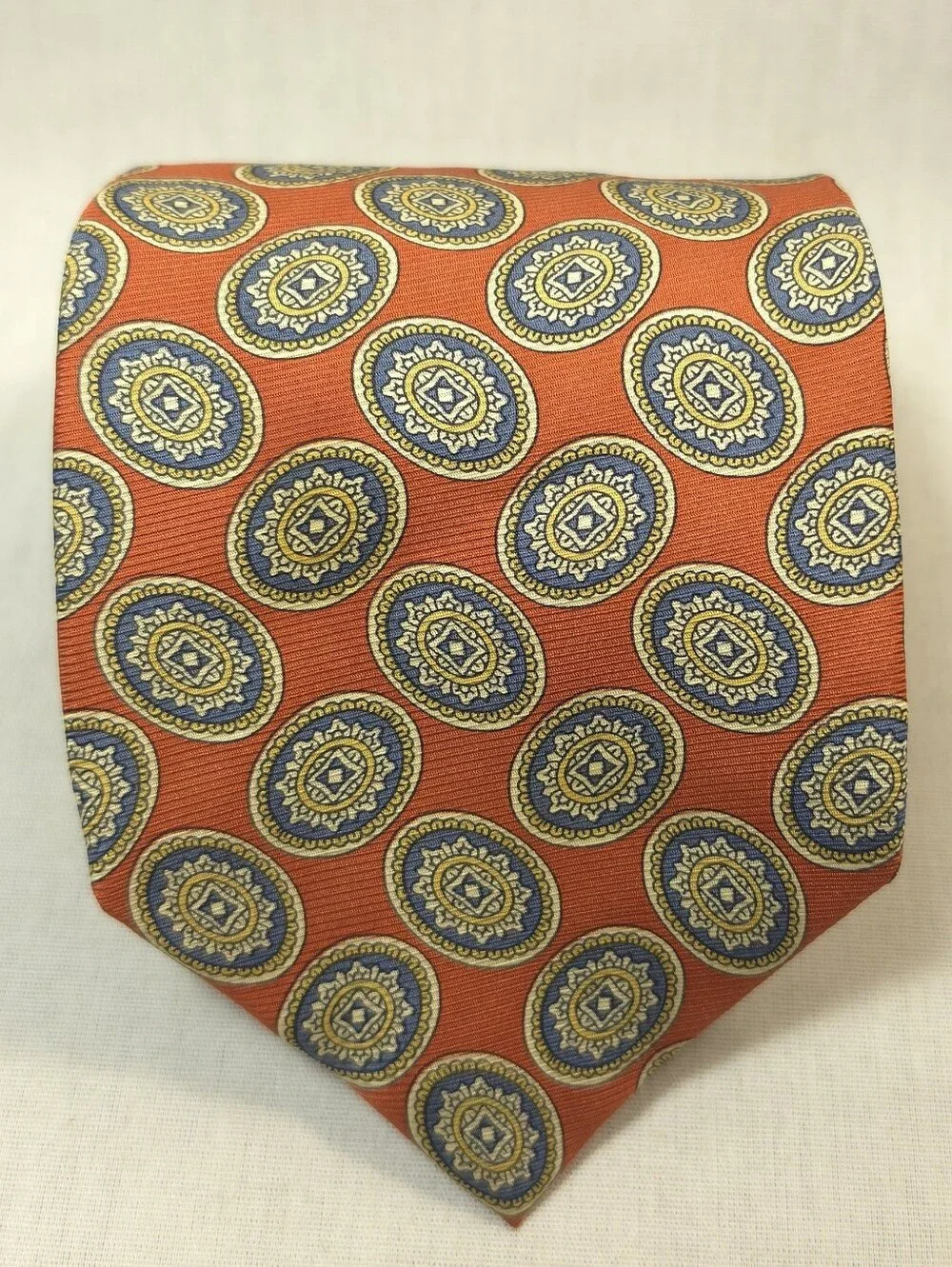 Jos. A. Bank Orange Tie with Blue and Gold Medallions
