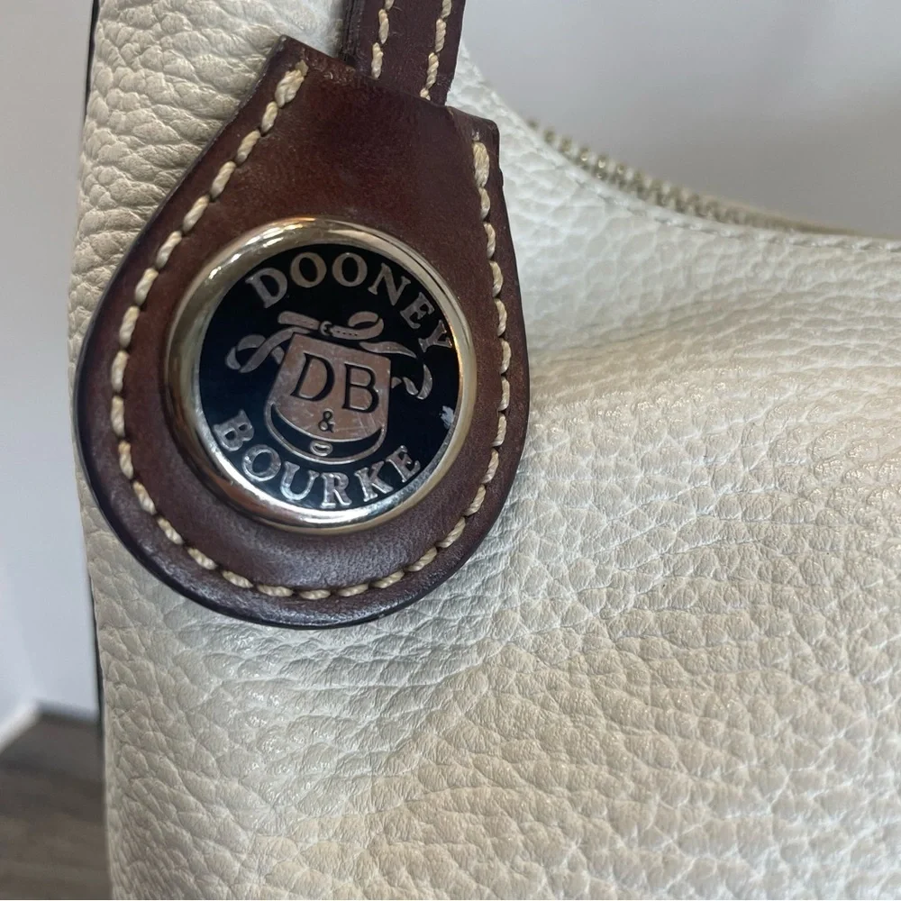 Dooney & Bourke cream versatile owned
