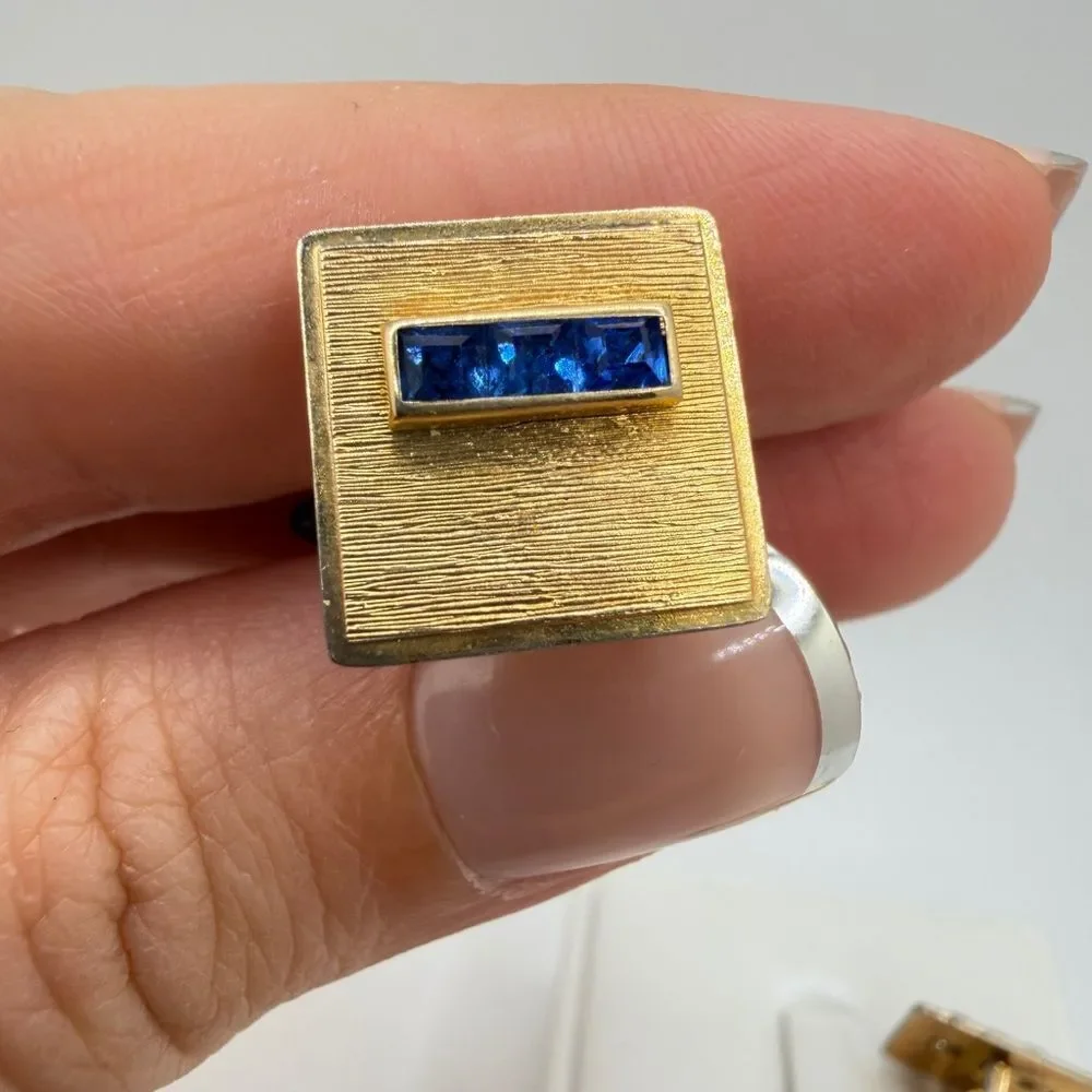 Vintage Krementz Gold tone cuff likes with princess cut blue rhinestone accents!
