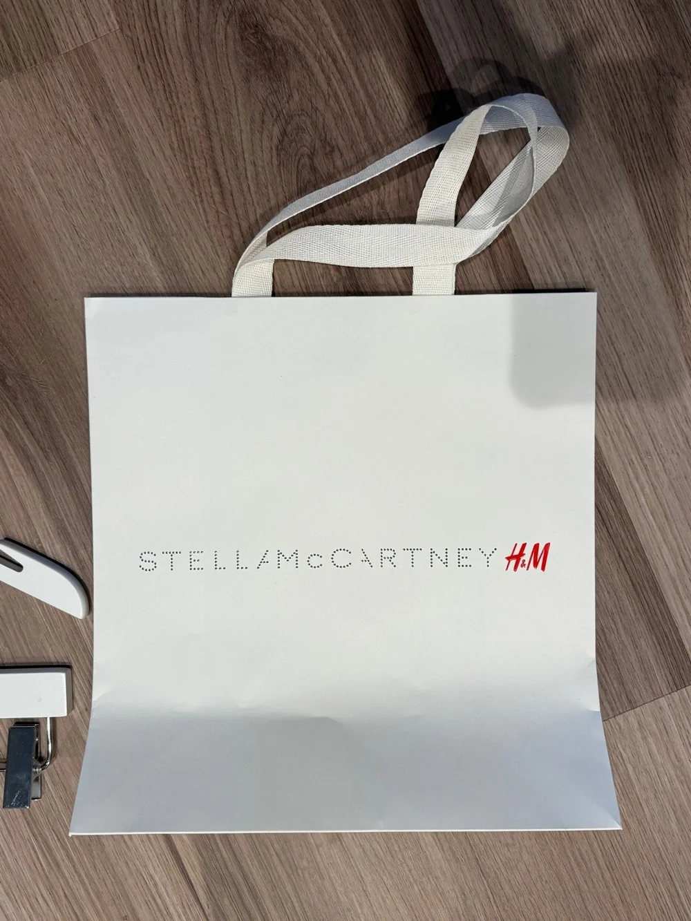 Stella McCartney H&M White Branded Shopping Bag with White Wooden Hangers