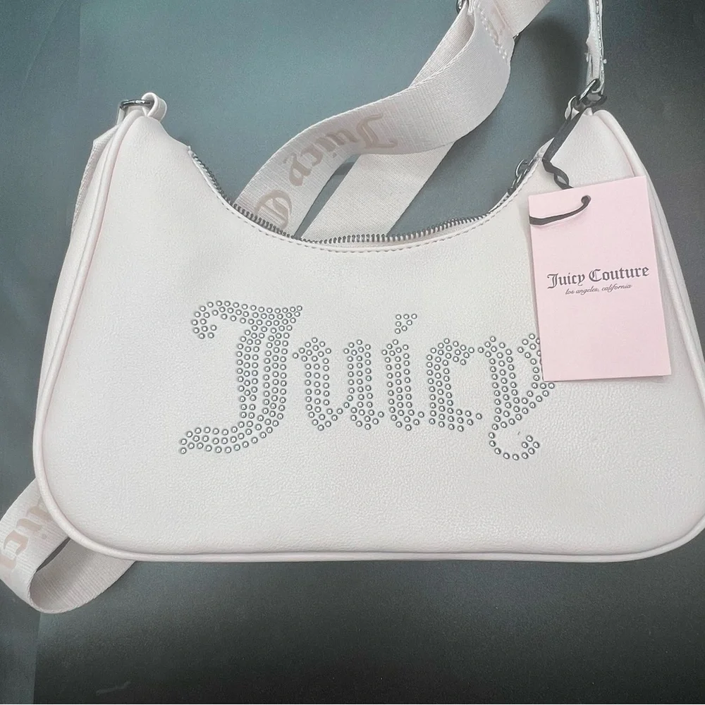 Juicy Couture Pink zip top Obsession Handbag with rhinestone logo