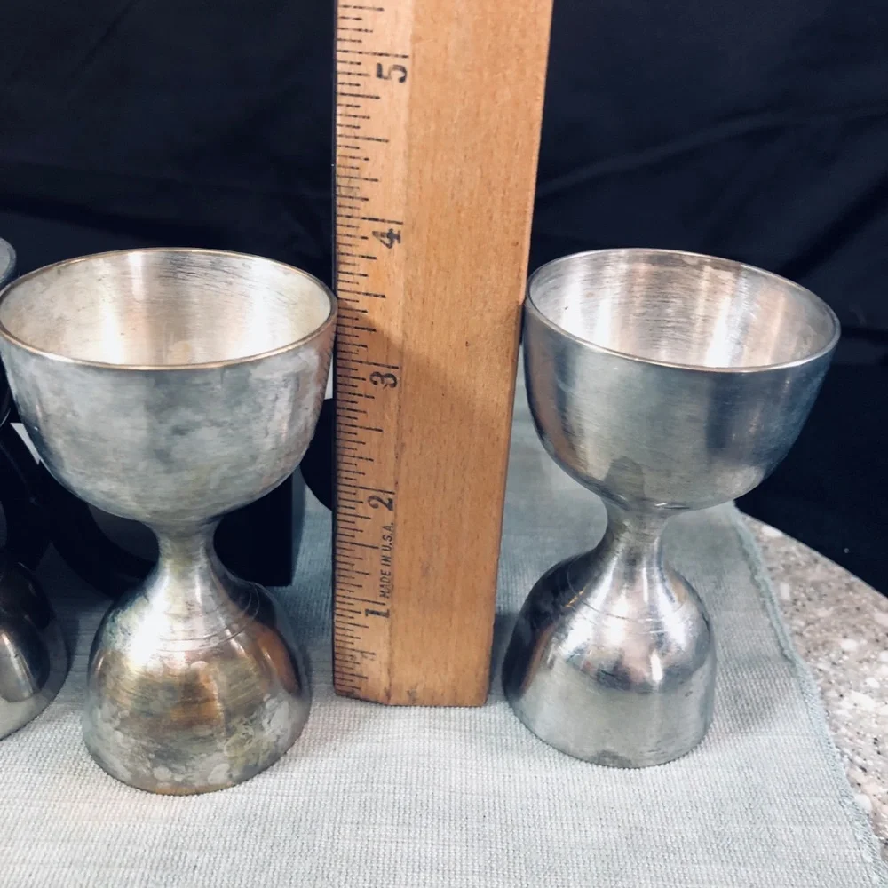 Set of Dansk Jette Stainless Steel flatware and / Four Stainless Steel Pegs