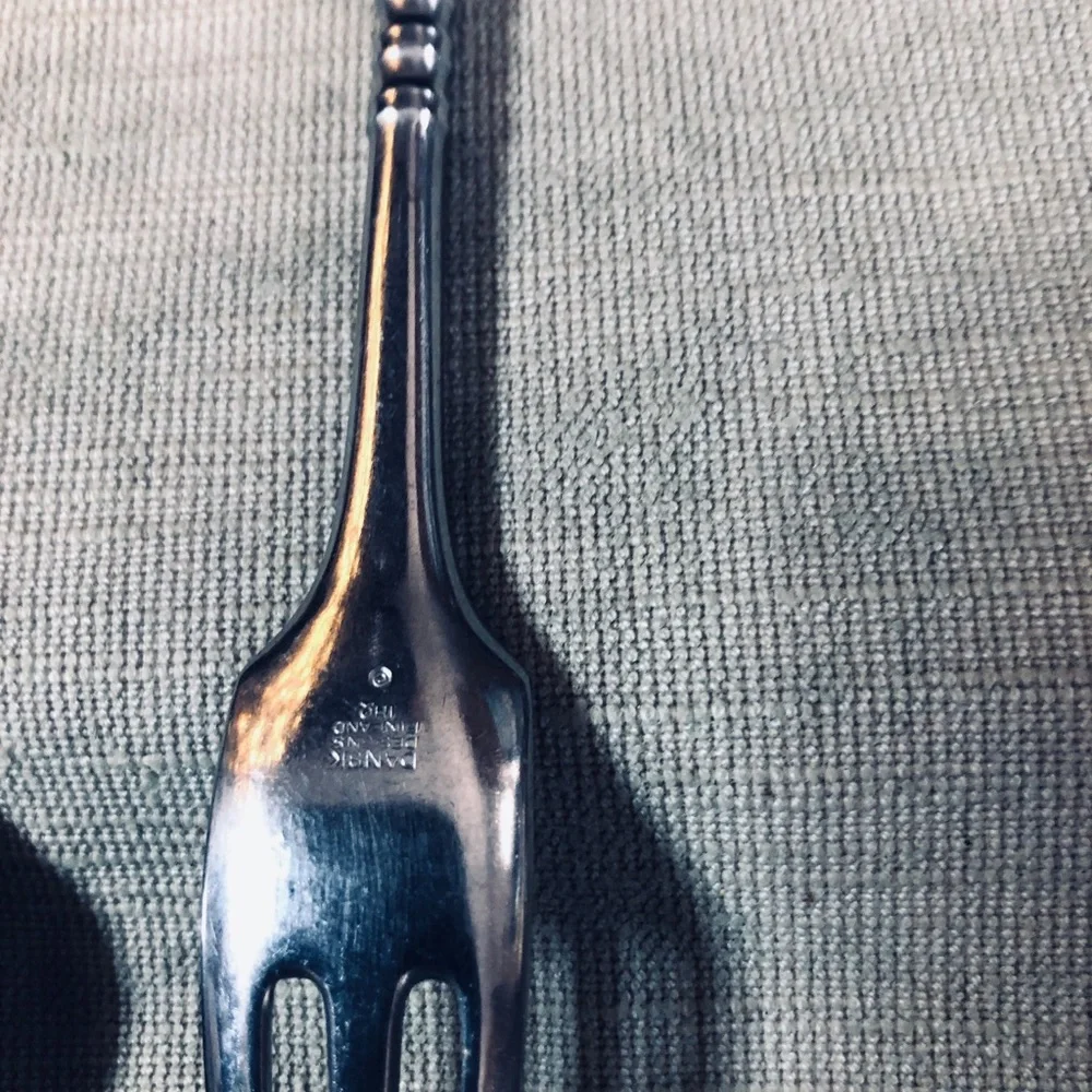 Set of Dansk Jette Stainless Steel flatware and / Four Stainless Steel Pegs