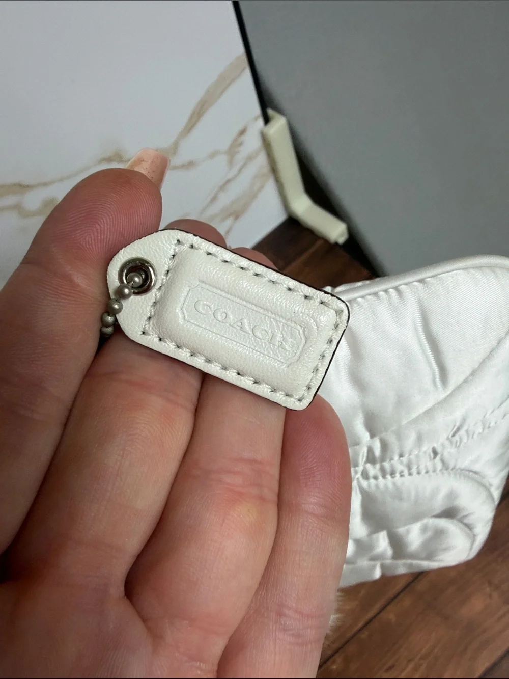 Coach Cream Quilted Wristlet with rabbit hair trim