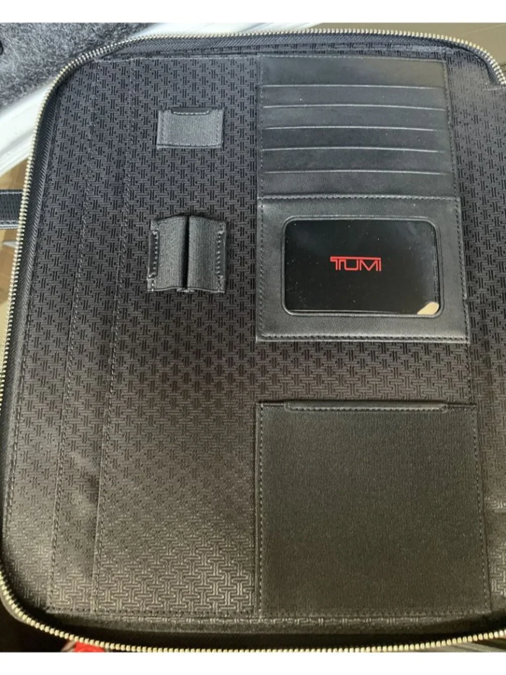 Tumi black leather