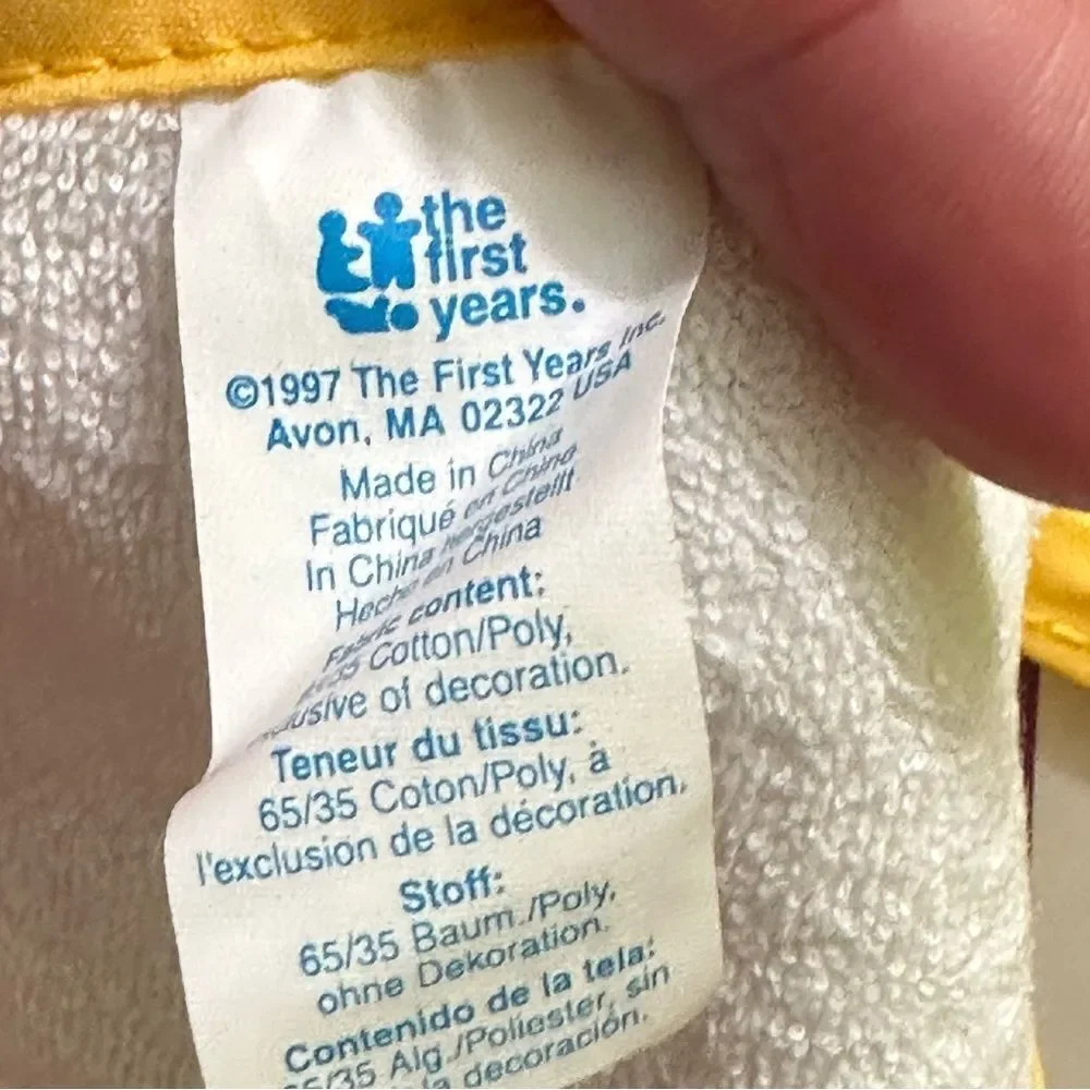 The first years Pooh Tie Bib Newborn