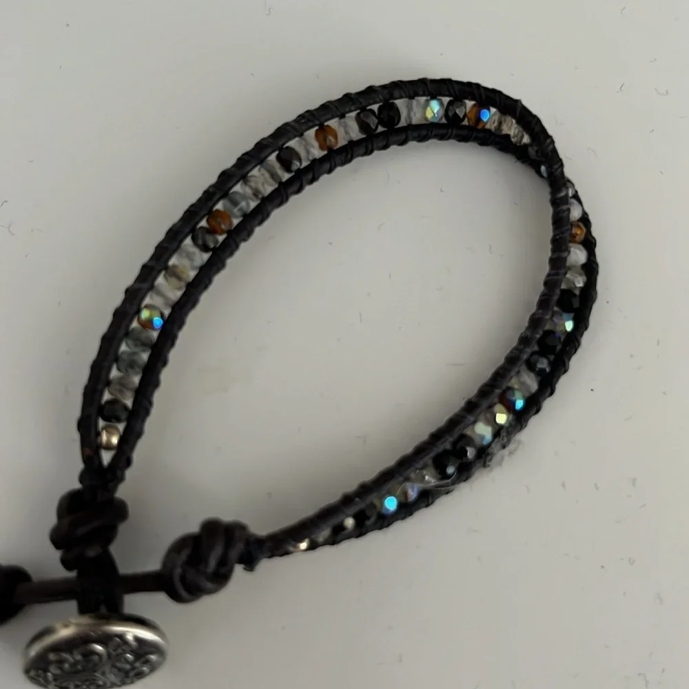 Black beaded rope bracelet with Celtic emblem